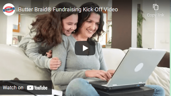 Butter Braid Kick-Off video screenshot of mom and daughter on computer with a play icon over image
